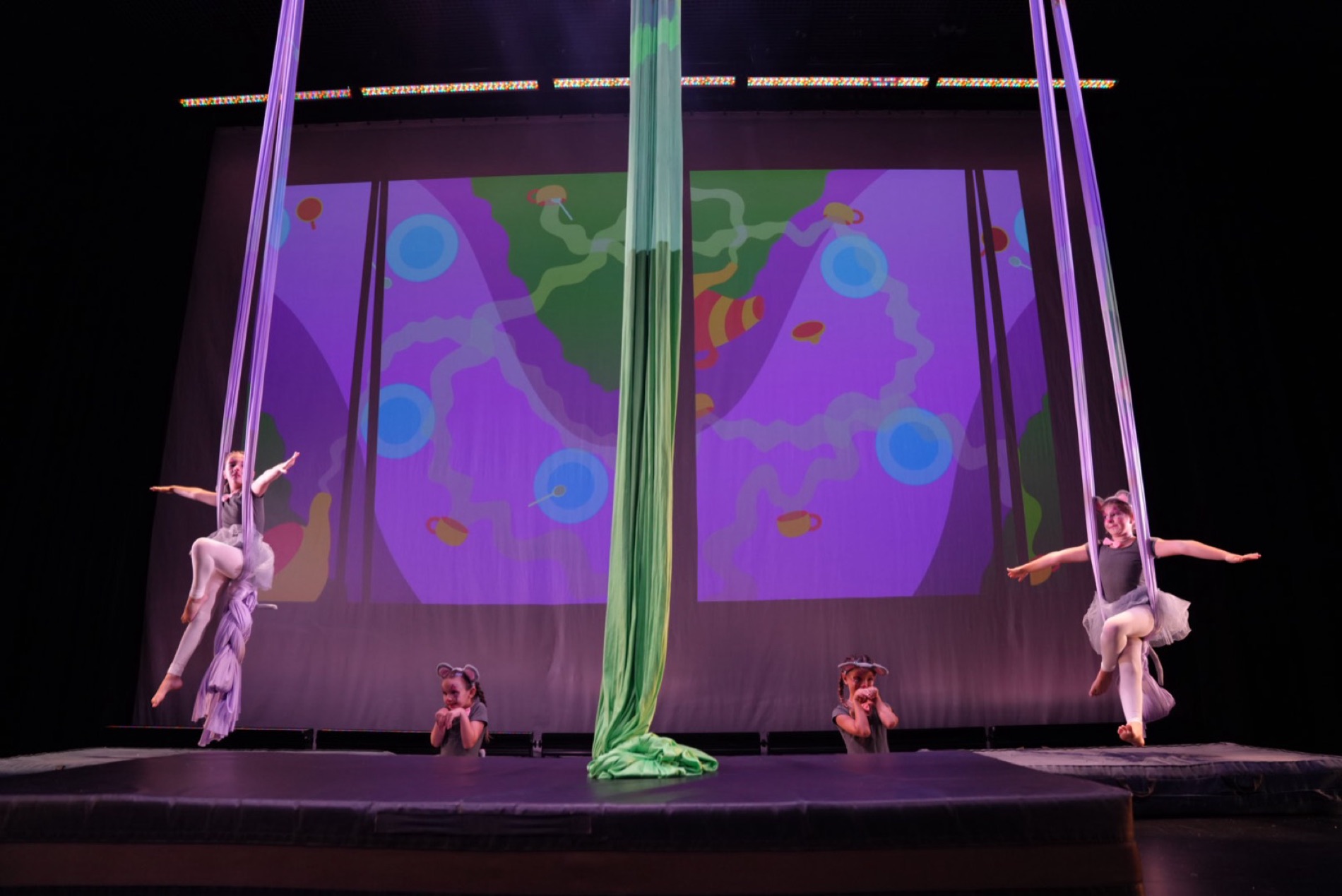 Students performing together on aerial silks