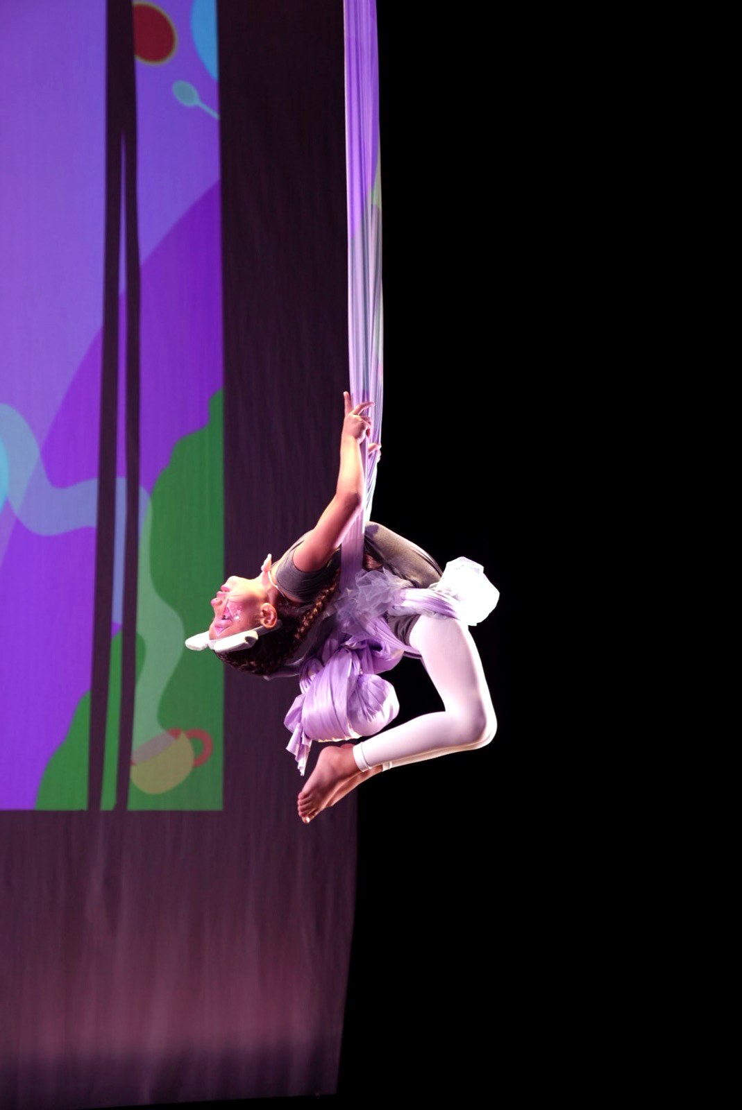 Student performing on aerial silks