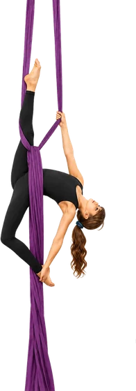 Young aerialist inverted and wrapped in aerial silks